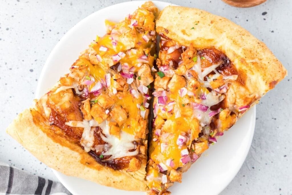 Slices of bbq pizza on a plate.