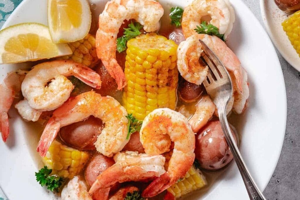 Boiled shrimp with corn.
