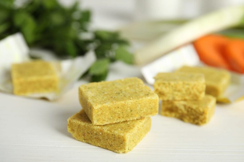 Bouillon cubes on a white surface.