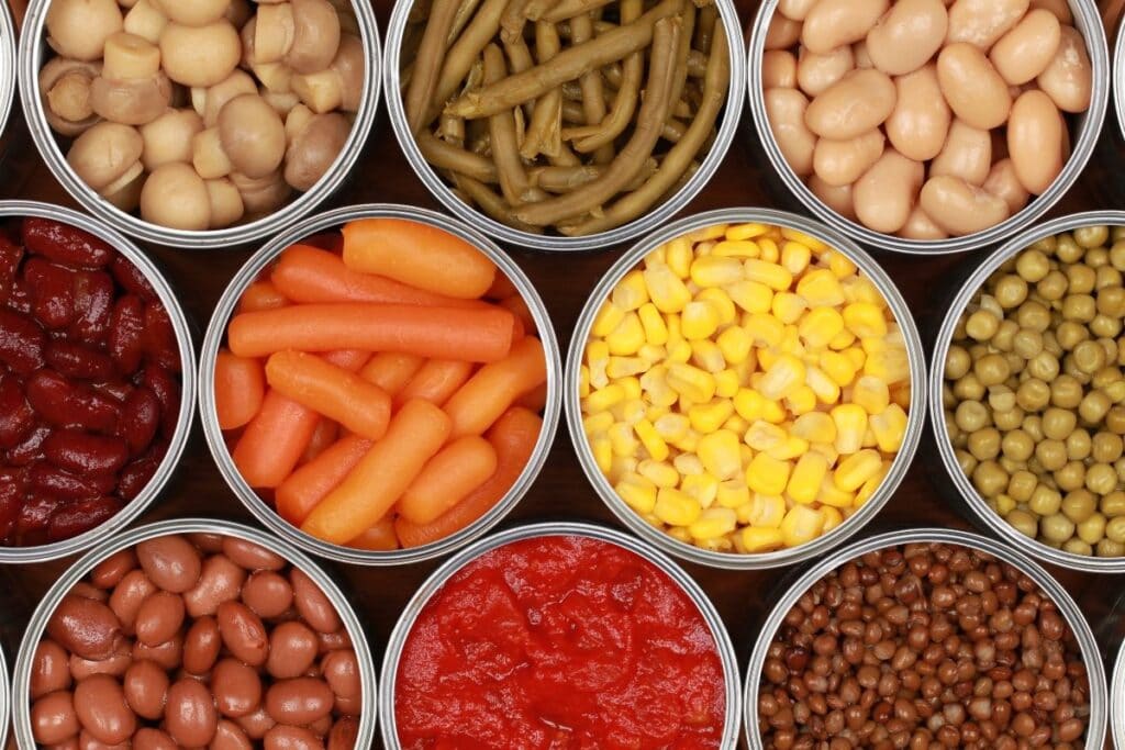 Different vegetables in cans.