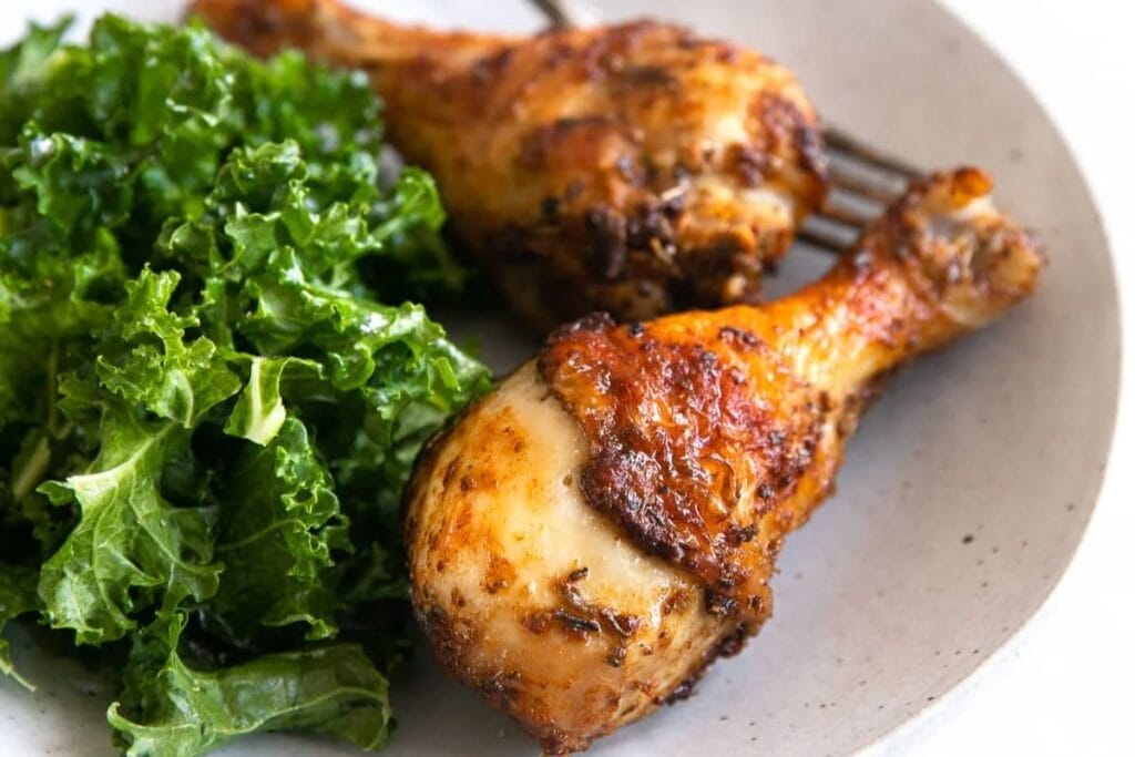 Chicken legs on a plate.