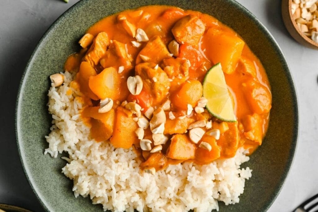Chicken curry with rice on a plate.