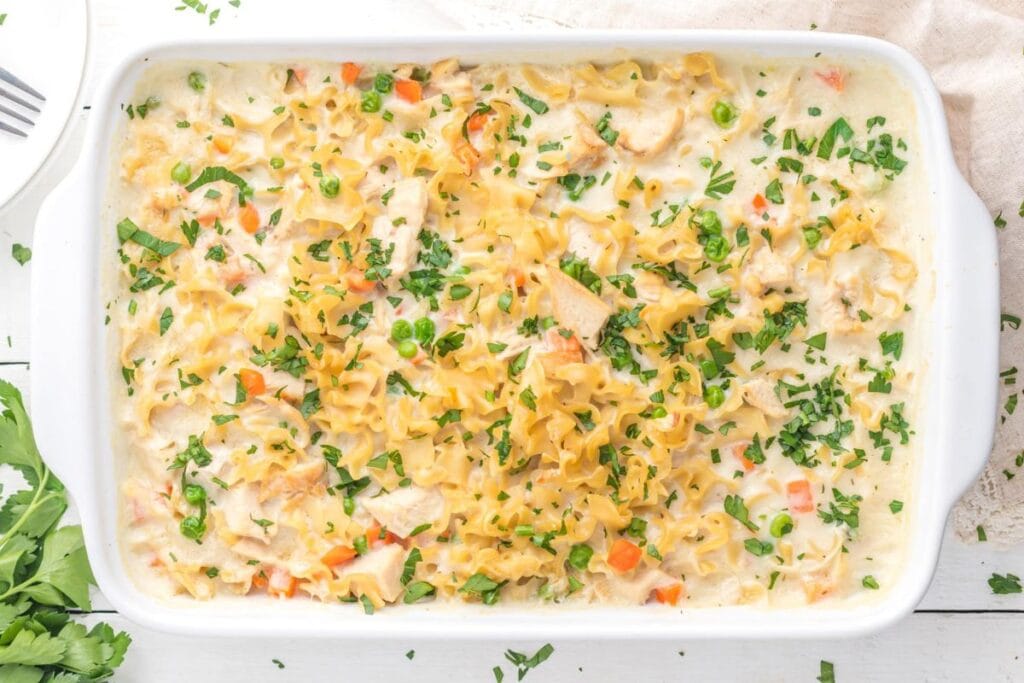 Chicken noodle casserole in a white dish.