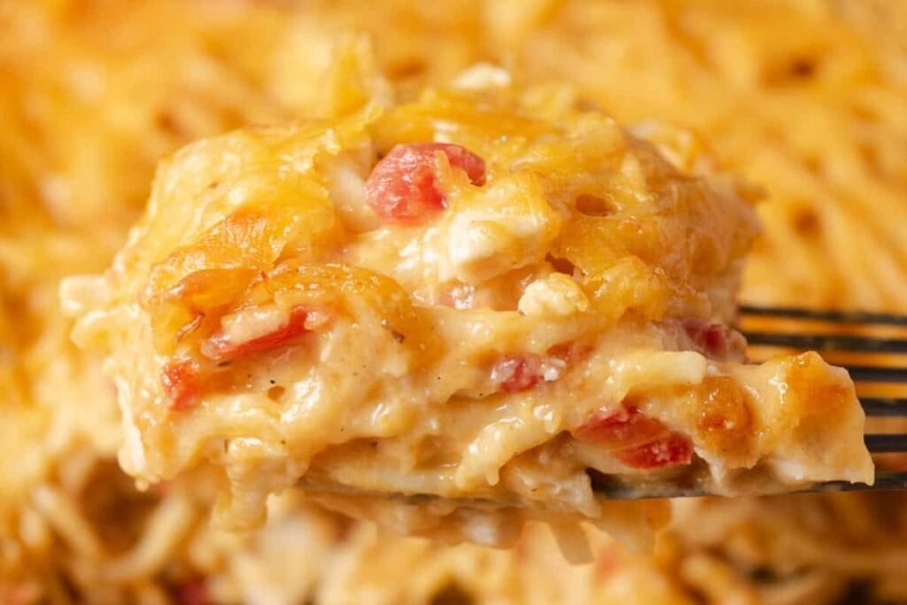 A close up shot of spaghetti with rotel.