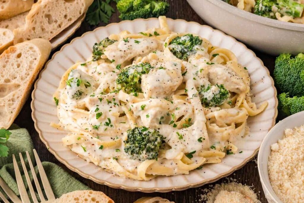 Chicken and broccoli alfredo on a plate.
