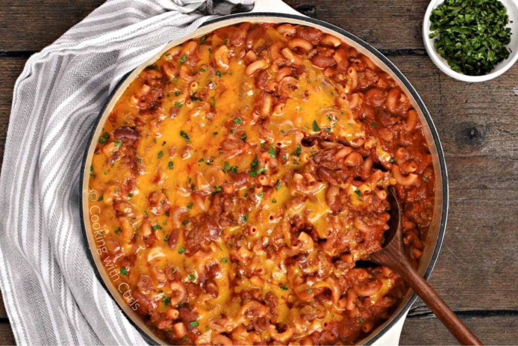 Chili mac and cheese in a pot.