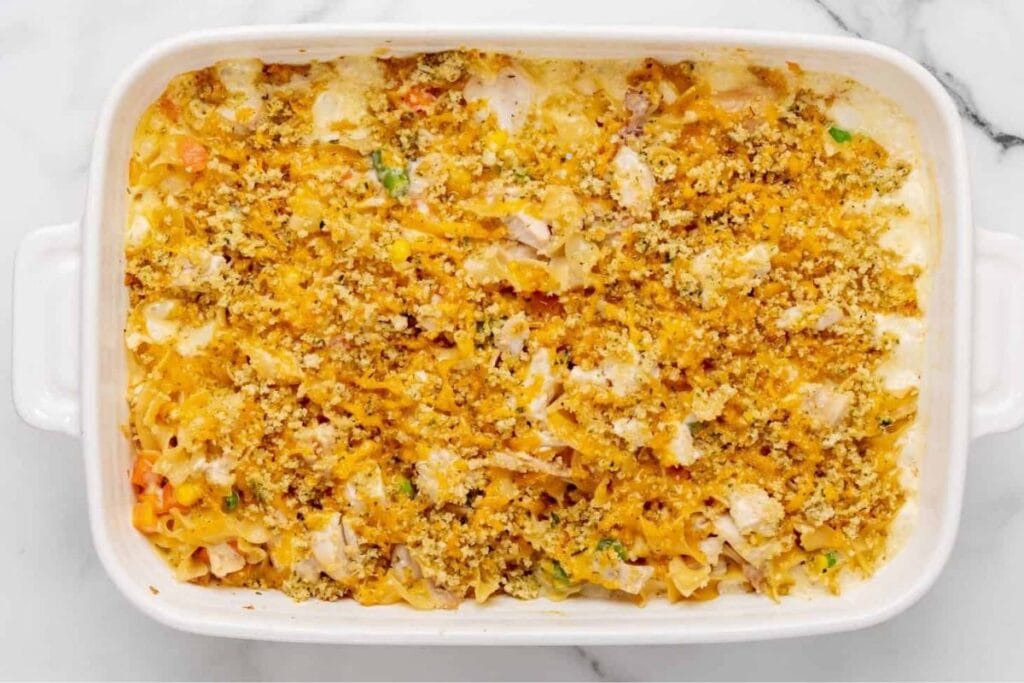 Chicken noodle casserole in a white dish.