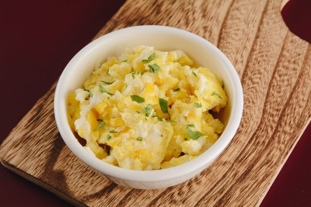 A bowl of scrambled eggs.