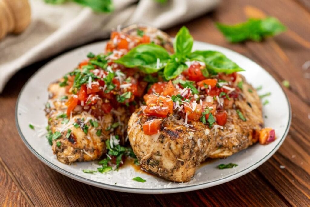 Bruschetta chicken on a plate.