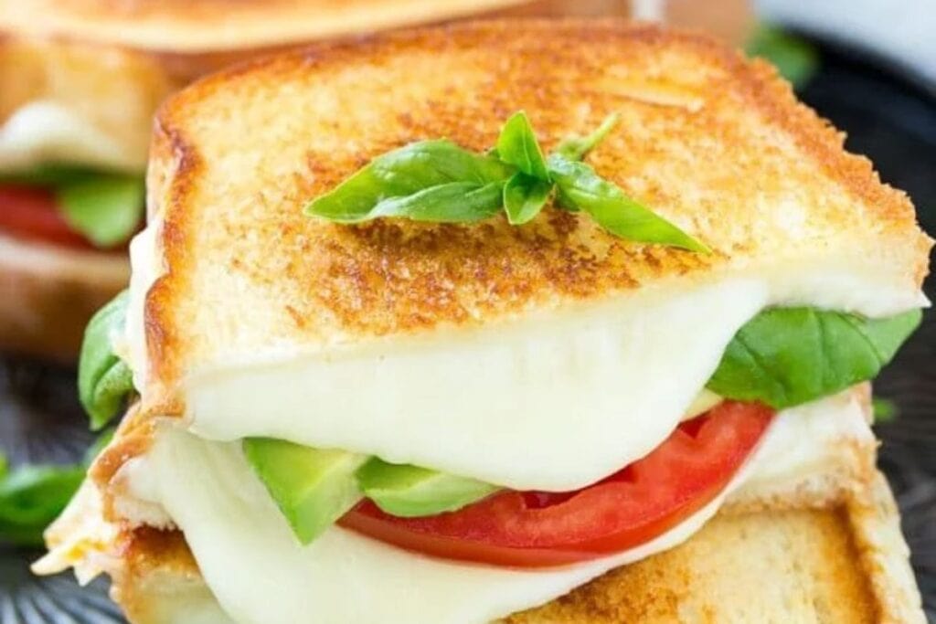 Caprese sandwich with melted cheese.
