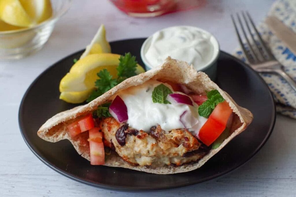 Grilled chicken burger on a plate.