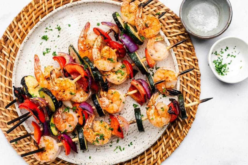 Grilled shrimp kabobs on a plate.