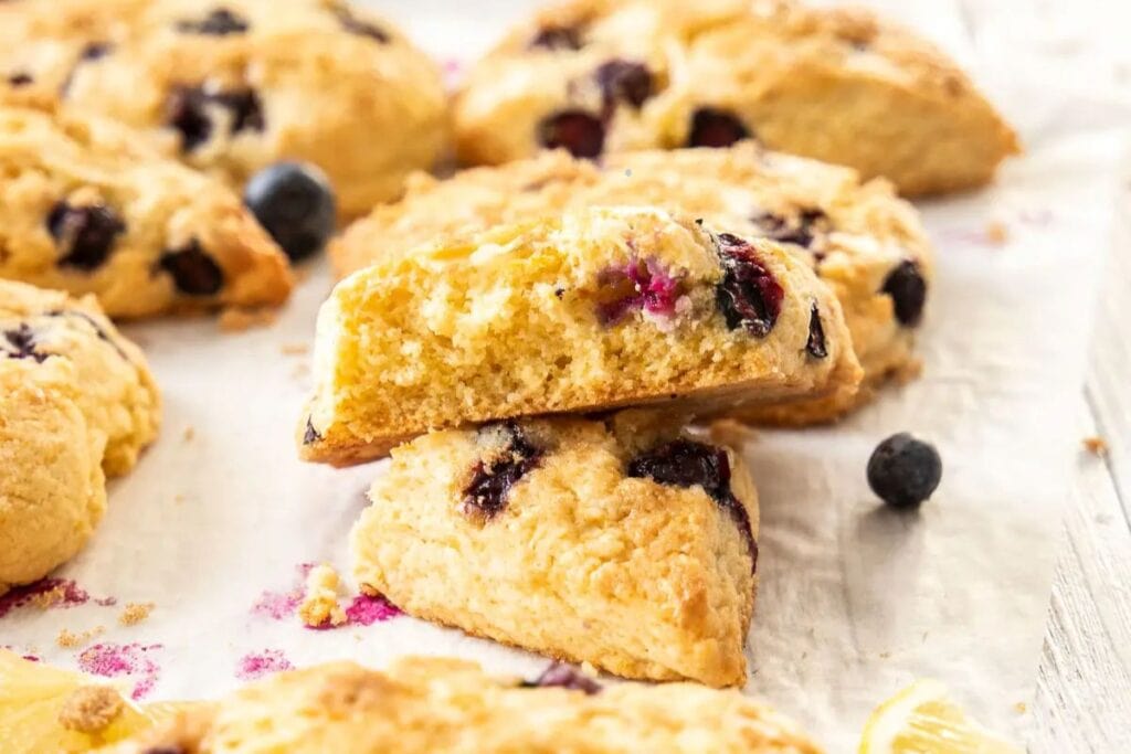 Lemon blueberry scones on a white background.