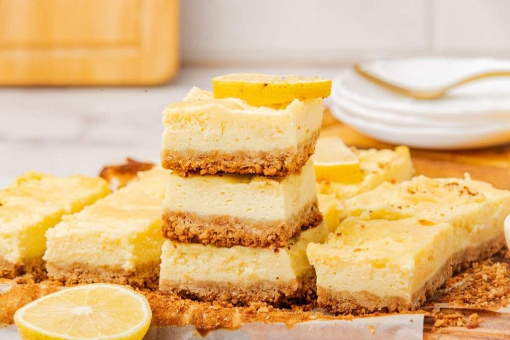 Stacks of lemon cheesecake bars.