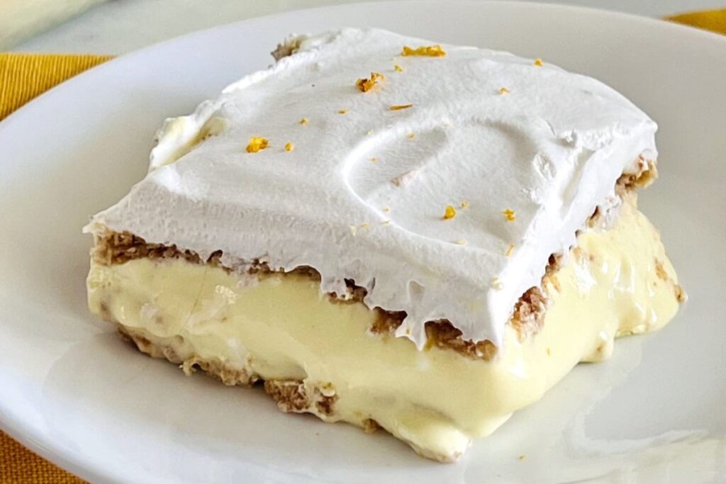 A slice of lemon icebox cake on a plate.
