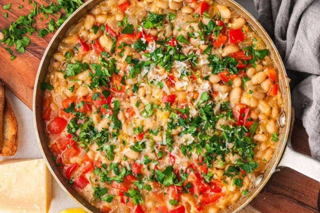 Parmesan white beans in a pan.
