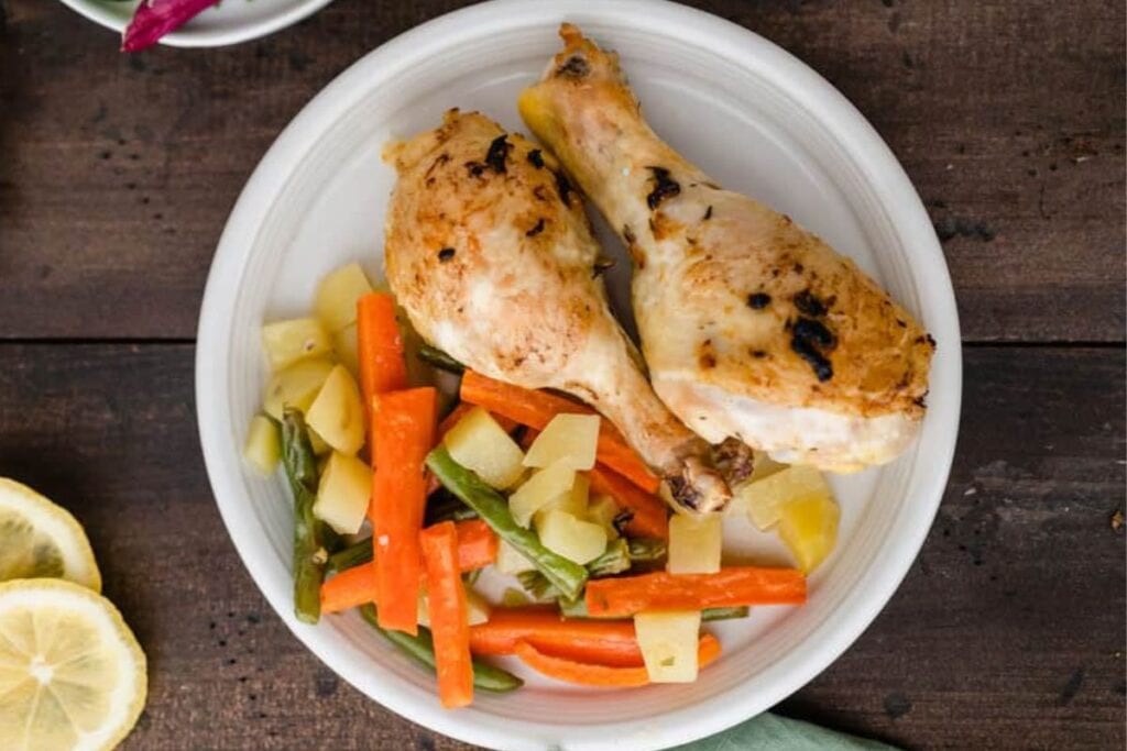 Chicken legs on a plate.