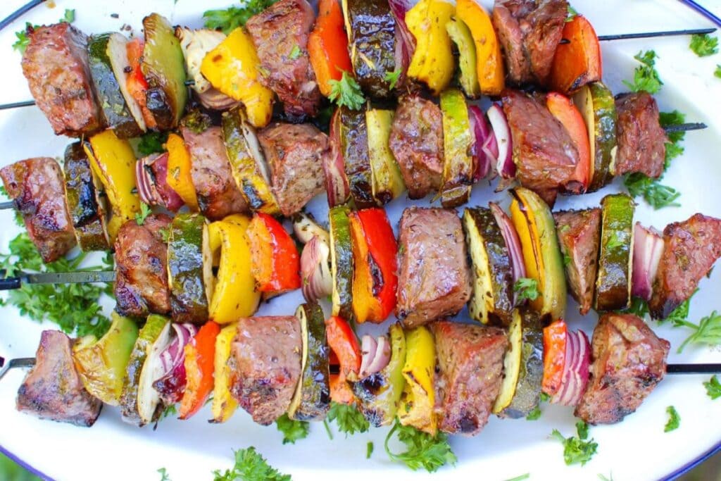 Beef kabobs on a plate.