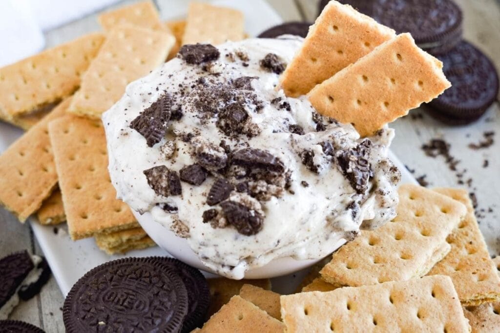 Oreo fluff dip with biscuits.