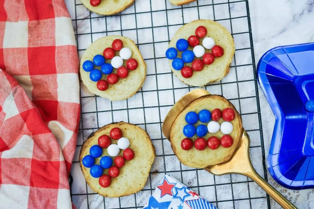 Cookies with M&M flags on baking rack.