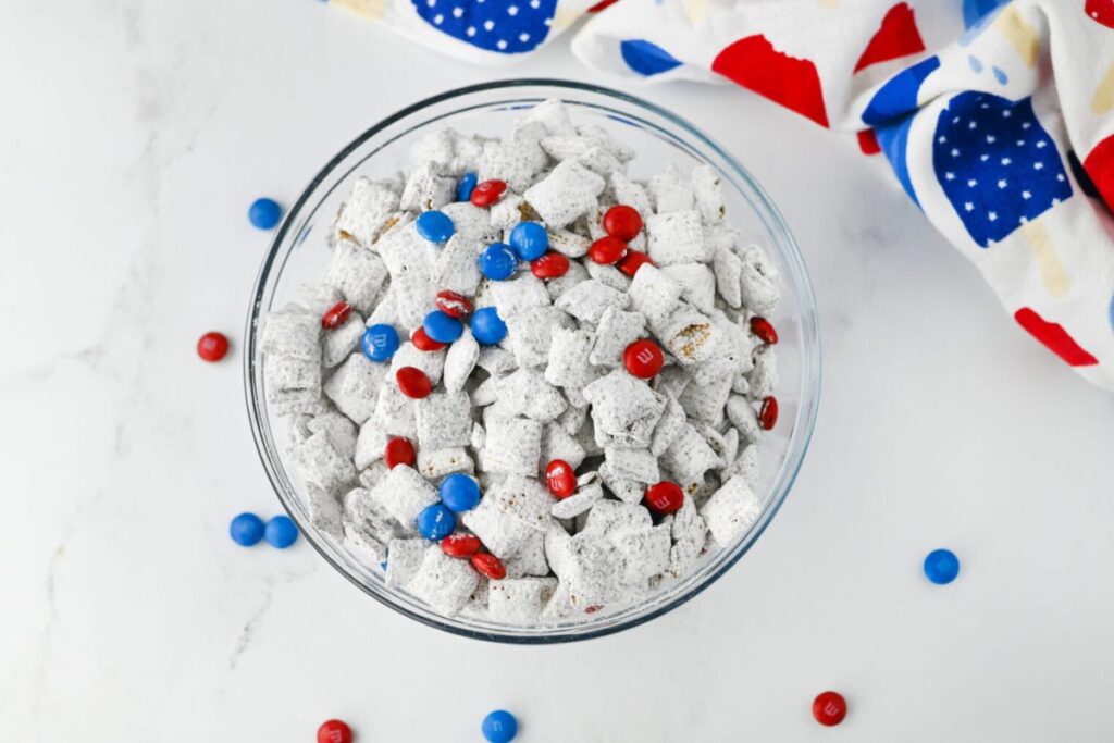 Puppy chow with red and blue M&M's.