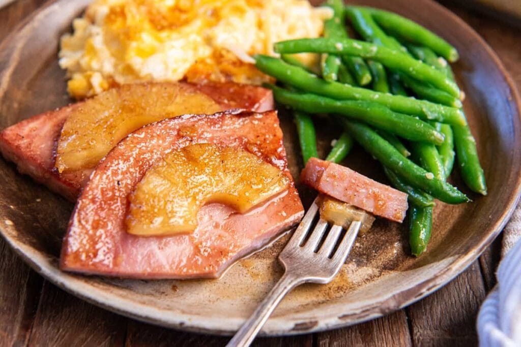 Pineapple ham steaks on a plate.