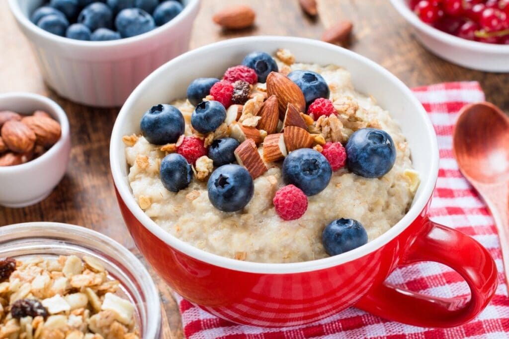 A bowl of oatmeal with berries.