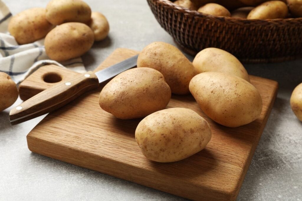 Potatoes on a wooden board.