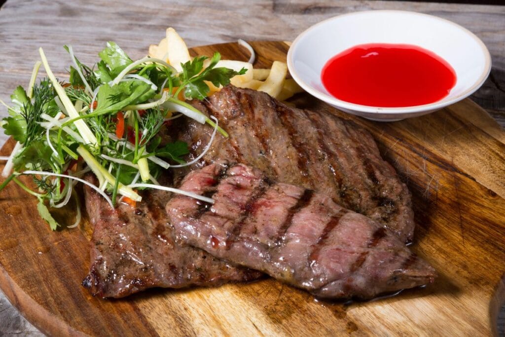Meat resting on a cutting board.