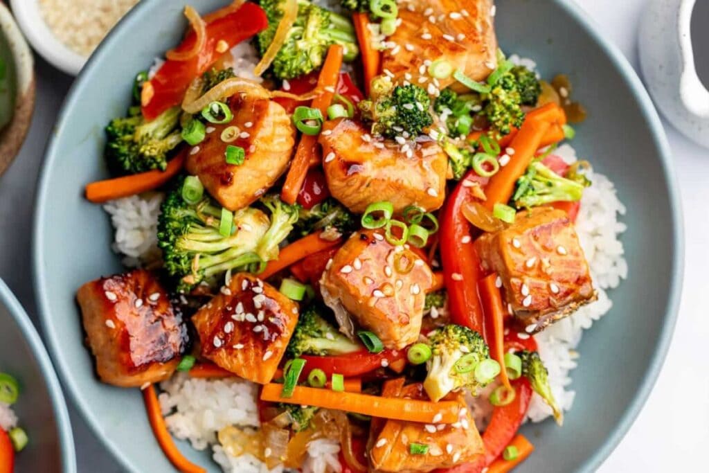 Salmon stir fry on a plate.