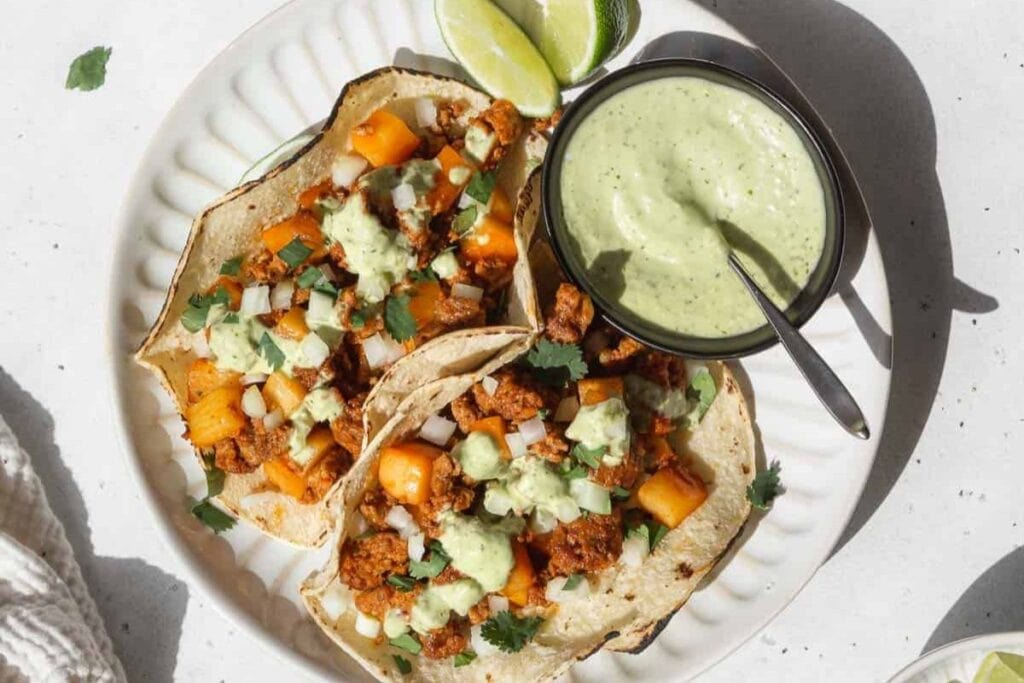 Sausage potato tacos on a plate.