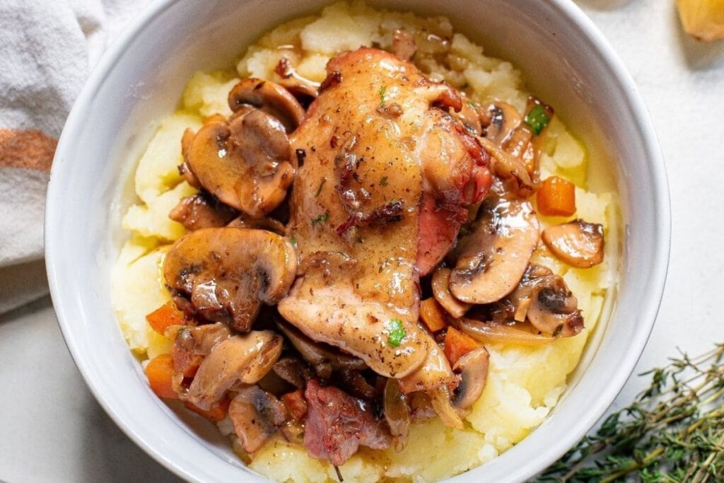 Chicken thighs in a bowl.