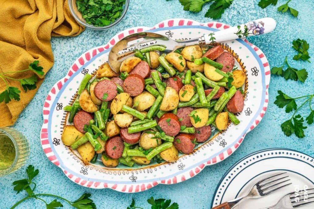 Smoked sausage and potatoes on a plate.