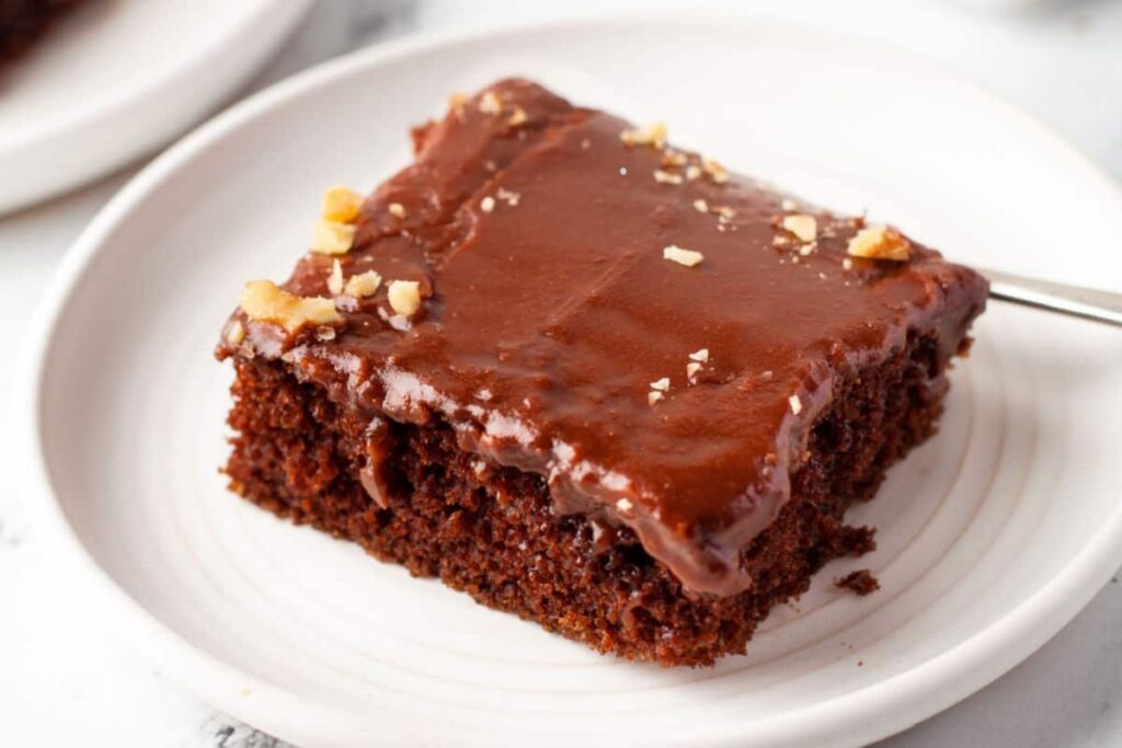 A slice of sheet cake on a plate.