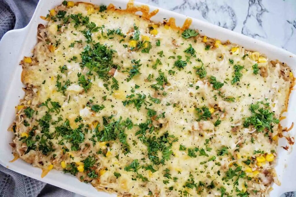 Tuna and rice casserole in a white dish.