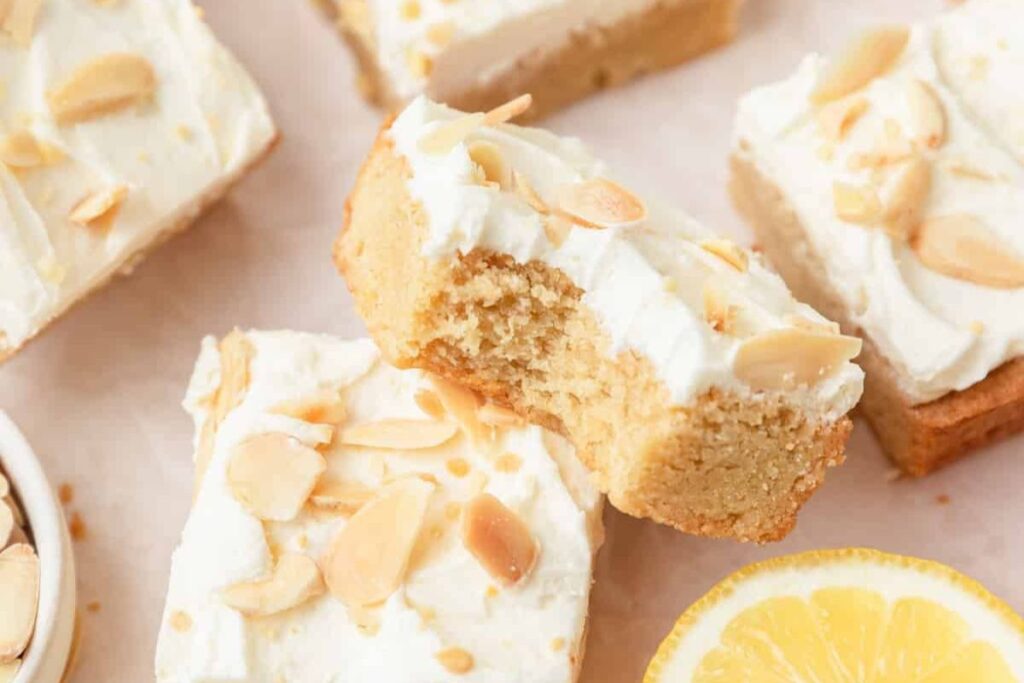 Lemon sugar cookie bars on light background.
