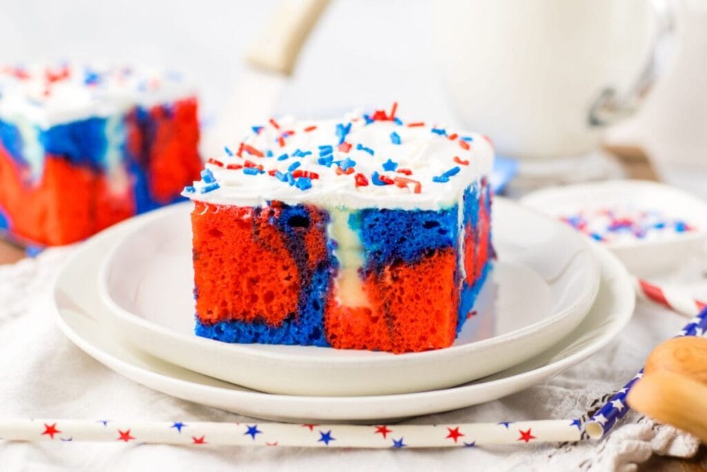 Red and blue swirled cake with frosting. 