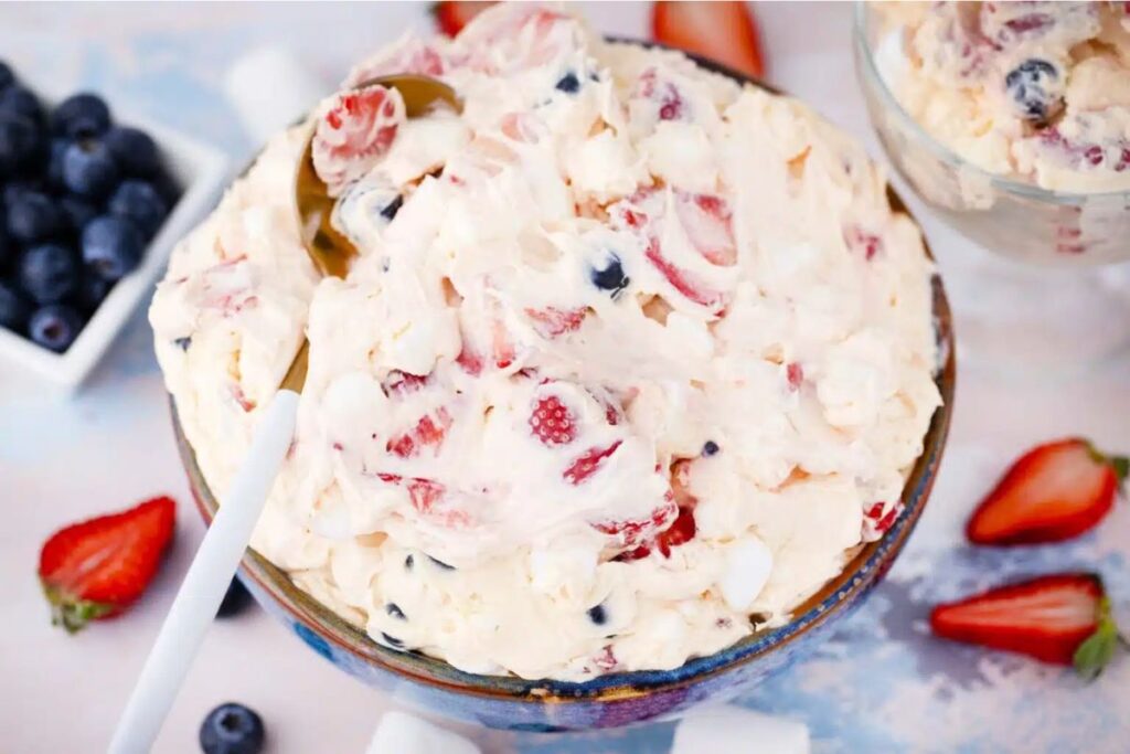  Cheesecake salad in bowl with strawberries.