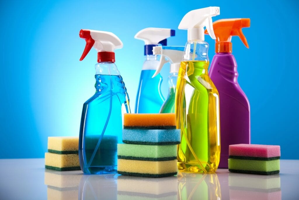 Cleaning supplies on a blue background.