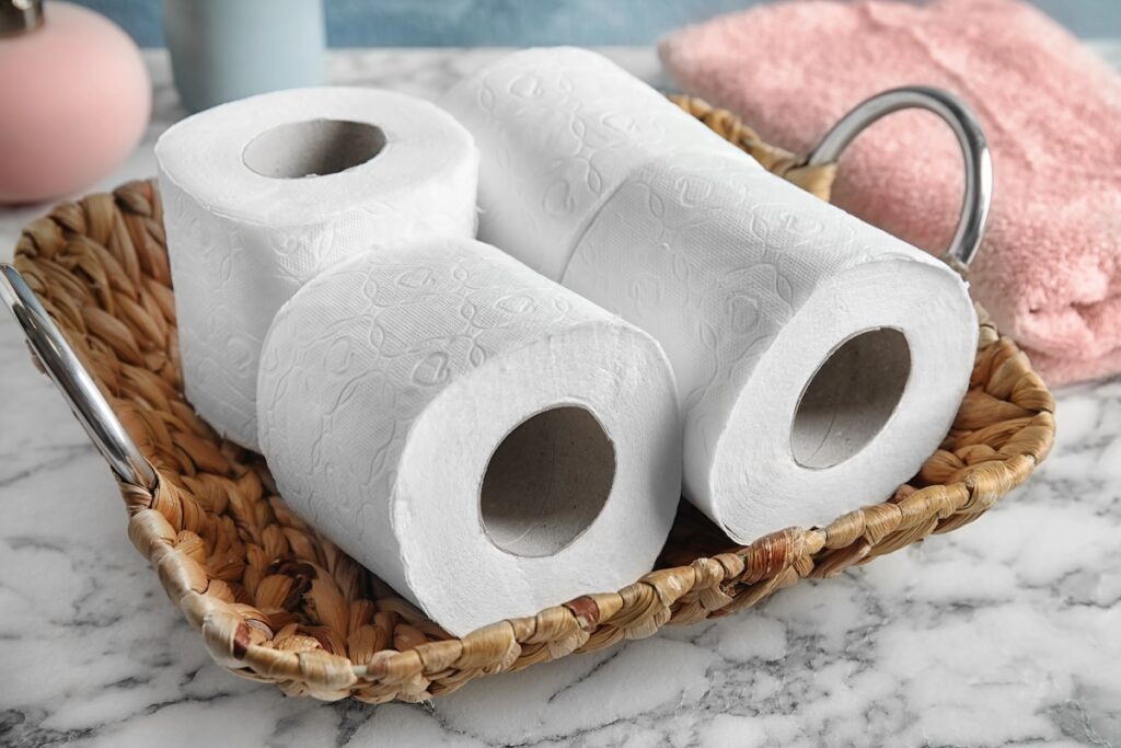 Toilet papers in a basket.