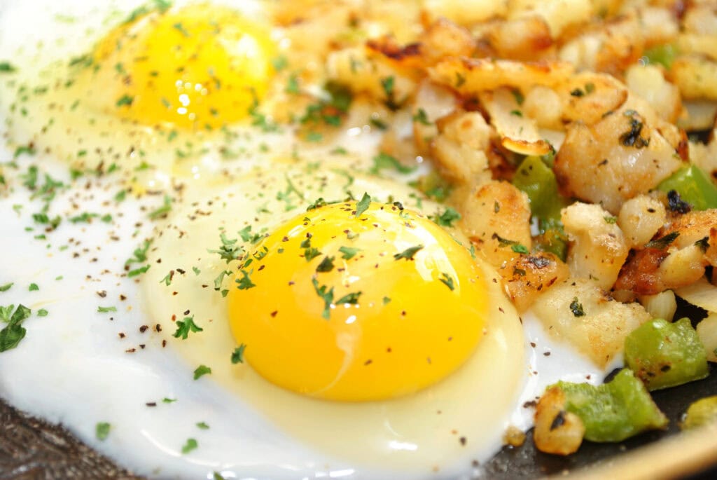 Eggs with potatoes close up shot.