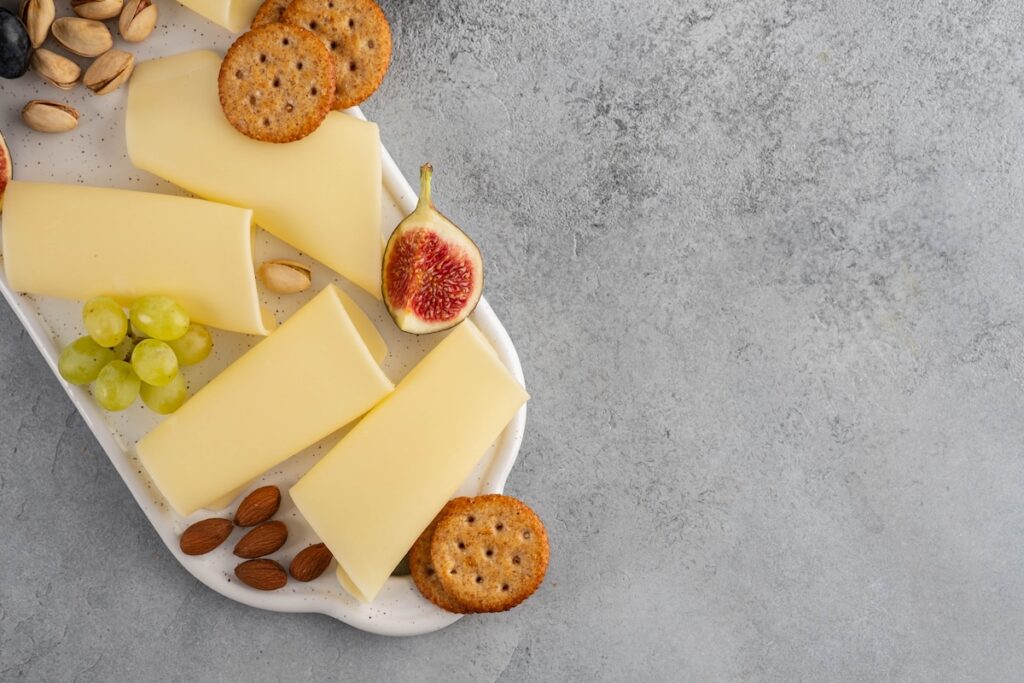 Slices of cheese on a plate.