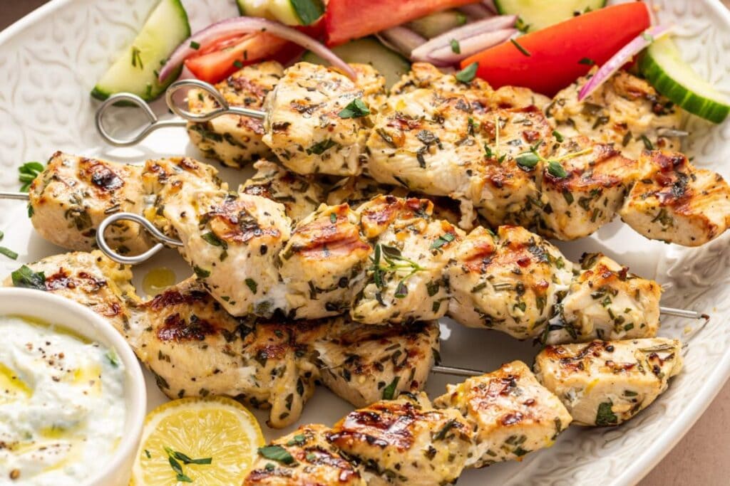 Chicken souvlaki on a plate.