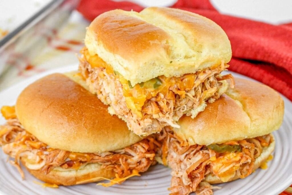 Chicken sliders on a plate.