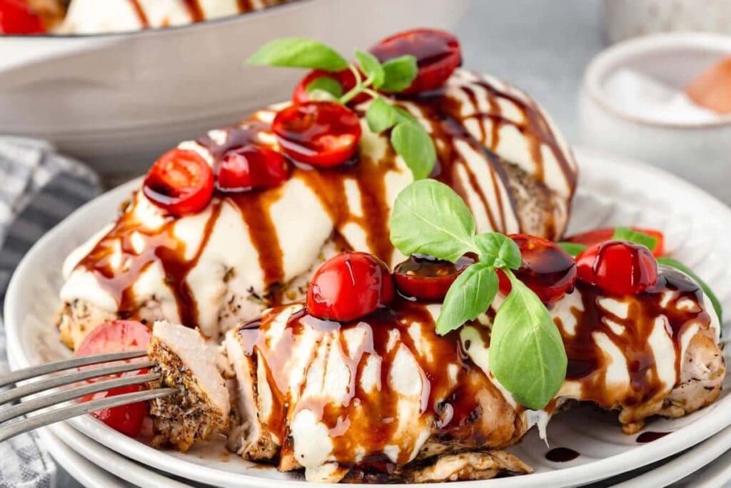 Chicken caprese on a plate.
