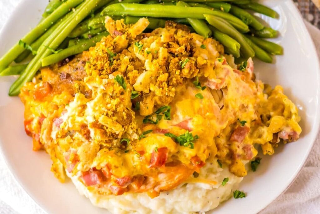 Chicken cordon bleu with vegetable on the side.