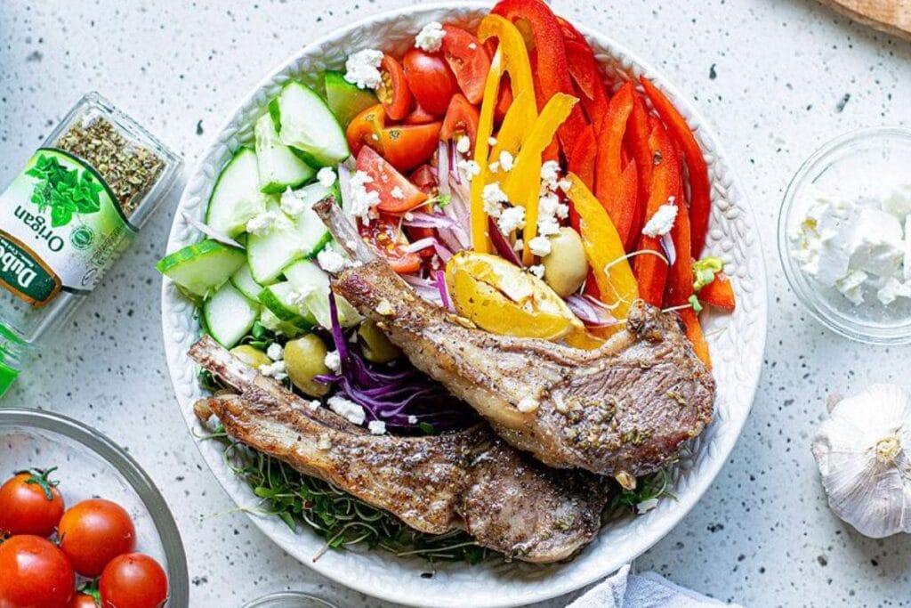 Baked pork chops on a plate.