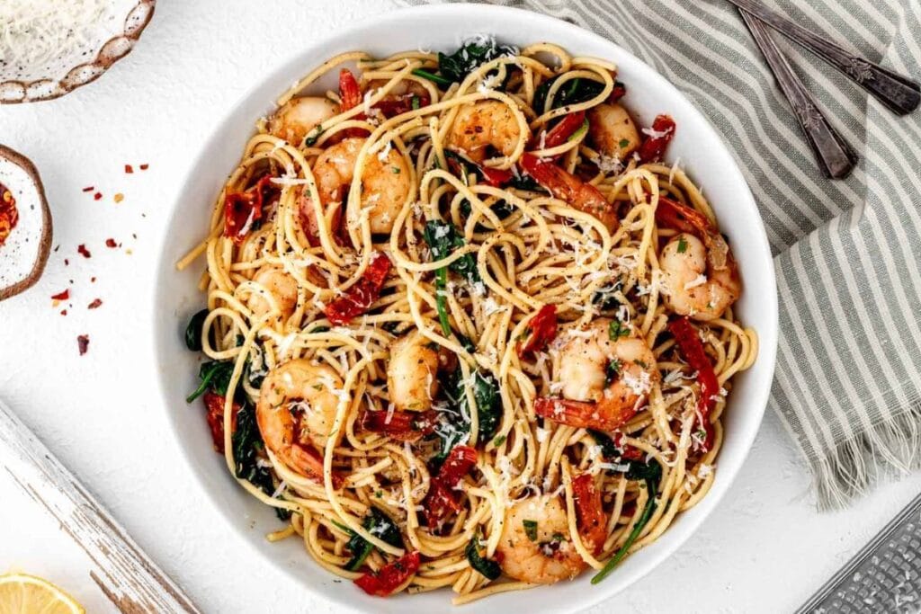 A bowl of lemon garlic pasta with shrimp.