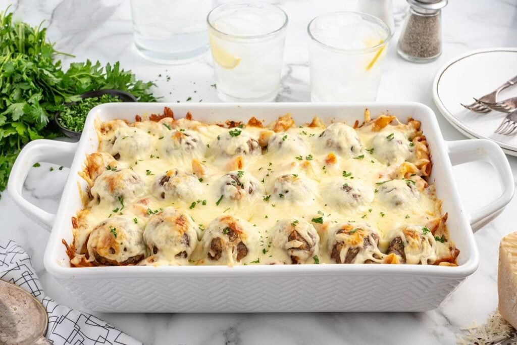 Meatball casserole in a white dish.