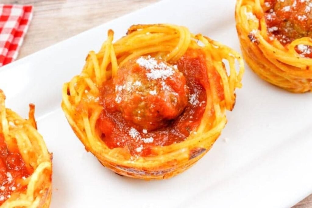 Spaghetti meatball cups on a plate.